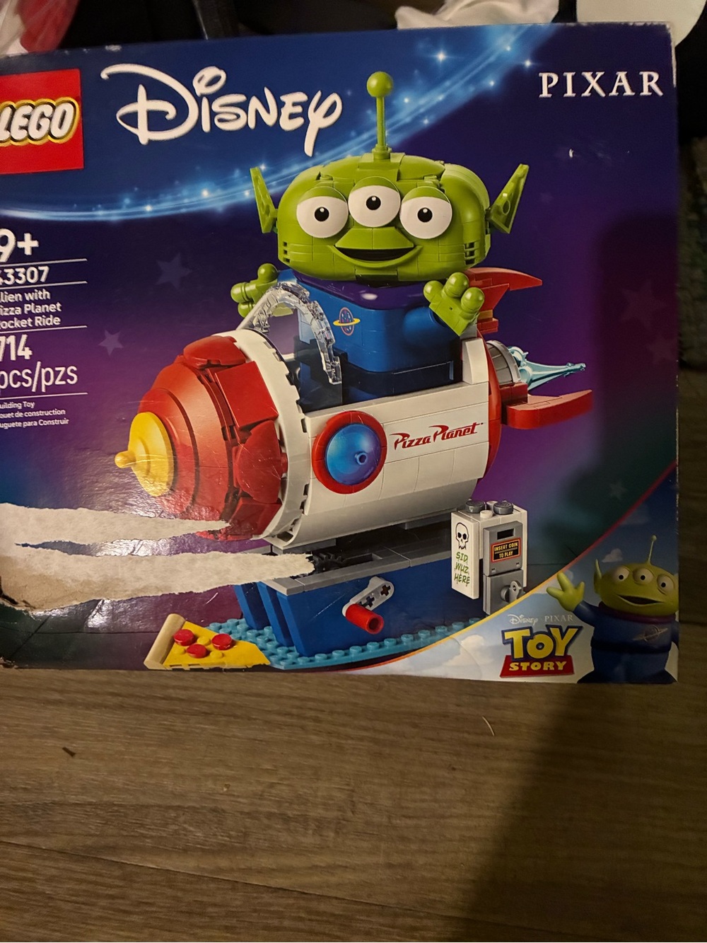 Disney Toy Story alien with pizza planet rocket ride